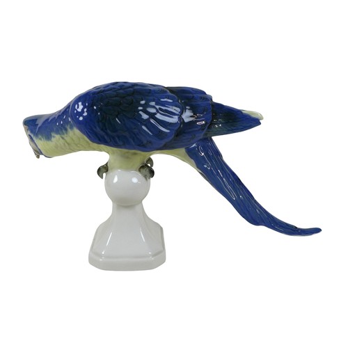 144 - A Royal Dux Bohemia porcelain parrot, with applied factory mark, printed and impressed marks to its ... 