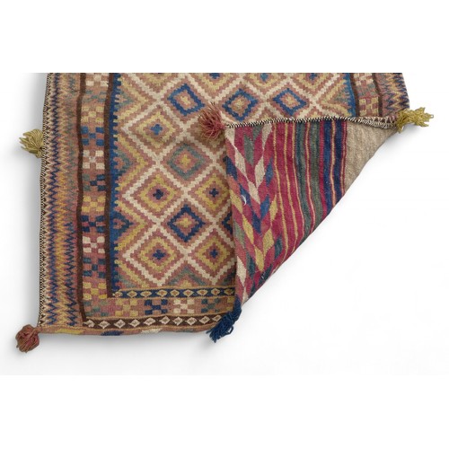 334 - A Kelim double pocket camel rug, 180 by 80cm.