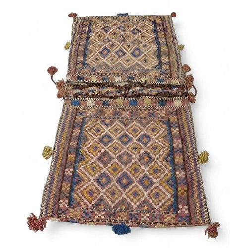 334 - A Kelim double pocket camel rug, 180 by 80cm.