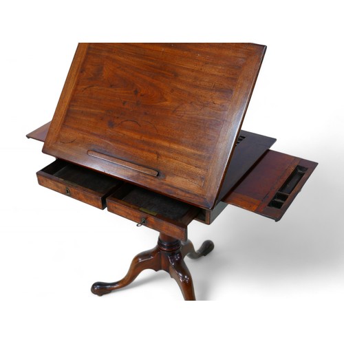 344 - A George III mahogany architects/drawing table, with a rising reading flap having a sprung rest, abo... 