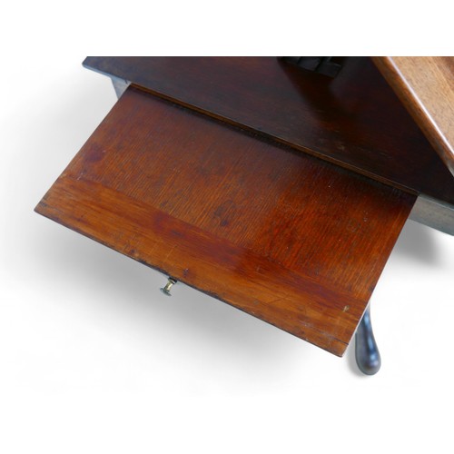 344 - A George III mahogany architects/drawing table, with a rising reading flap having a sprung rest, abo... 