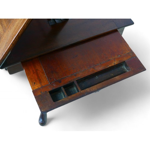 344 - A George III mahogany architects/drawing table, with a rising reading flap having a sprung rest, abo... 