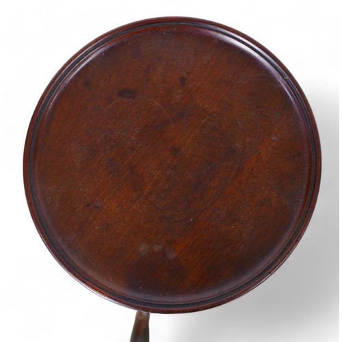 325 - A George III style mahogany wine table, on a carved tripod  base, 25cm diameter top 55cm high.