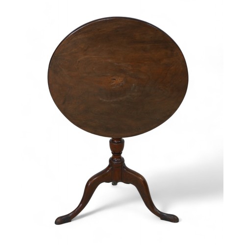 331 - A George III mahogany tilt top wine table, on a turned column and tripod base, 60cm diameter 70cm hi... 