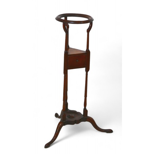 323 - A George III mahogany wig stand, with a powder drawer on platform tripod base, 25cm diameter top 84c... 