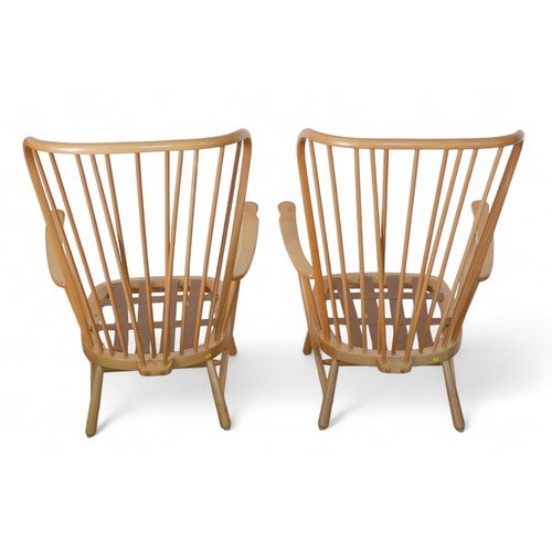 333 - A pair of Ercol beech stick back armchairs. (2)