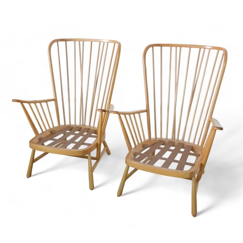 333 - A pair of Ercol beech stick back armchairs. (2)