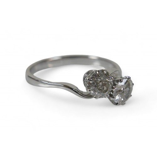 60 - A white metal two stone diamond crossover ring, the diamond measure approximately 5 by 2.8mm 0.40ct ... 