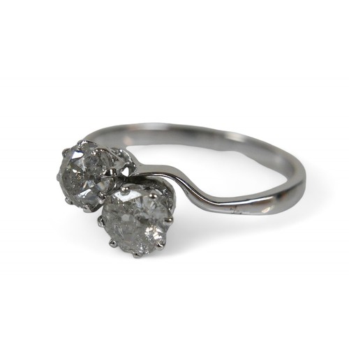 60 - A white metal two stone diamond crossover ring, the diamond measure approximately 5 by 2.8mm 0.40ct ... 