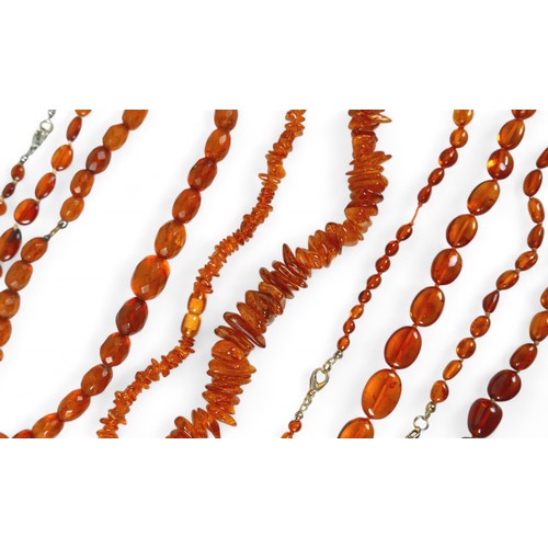 12 - A collection of eleven necklaces including amber and jet, also a horn necklace. (1 bag)