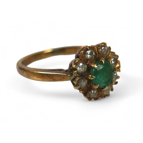 29 - A 9ct yellow gold emerald and diamond cluster ring, 9mm diameter head, ring size I, 2.7g.