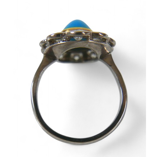 5 - An 18ct white gold turquoise and diamond ring, each round cut diamond approximately 3mm diameter, ov... 