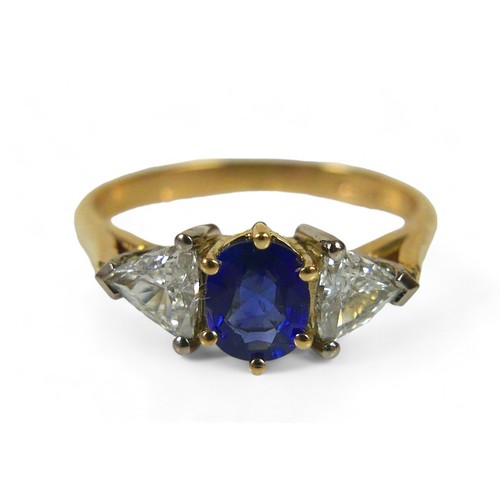 64 - An 18ct gold natural blue sapphire and diamond ring, the oval cut sapphire, approximately 4 by 5mm, ... 