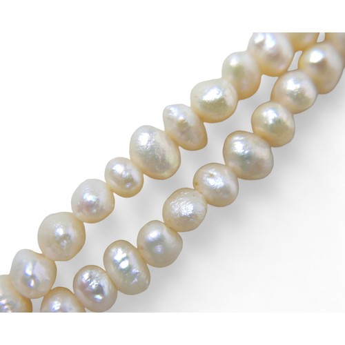 9 - A pearl necklace with 9ct gold and diamond clasp, with two strands of irregular pearls, approximatel... 