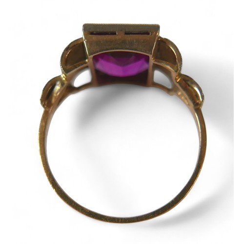 49 - An 18ct gold pink sapphire ring, the convex rectangular cut sapphire, 8 by 11mm, size O, 3.6g, an 18... 