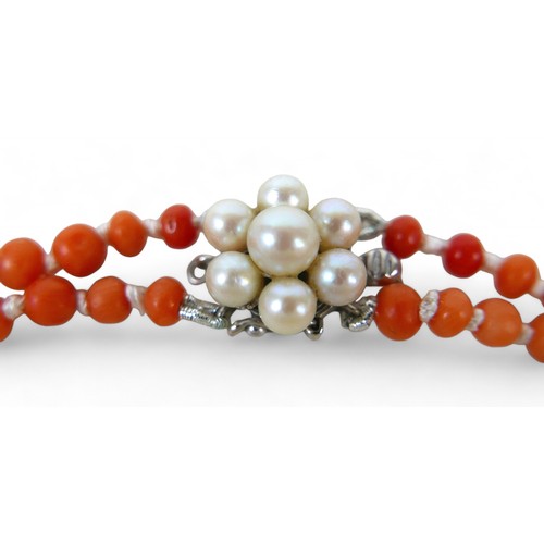 39 - Three coral necklaces, two with 14ct white gold clasps and pearls, longest 45cm long, 65.2g gross.