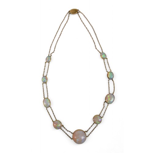 65 - An opal and yellow metal double strand necklace, made up of nine opals of graduating sizes, the cent... 