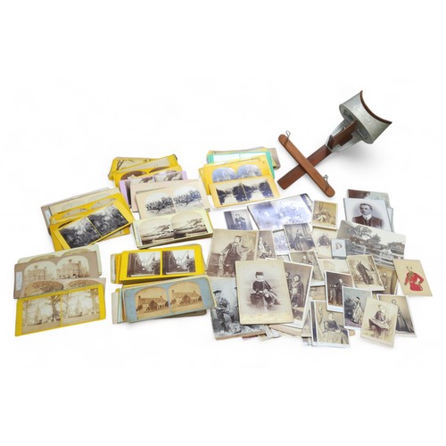 180 - A stereoscope and over 100 stereoscopic cards, together with over 40 carte de visite photographic po... 