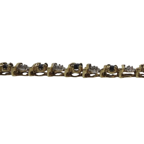 34 - A 9ct gold tennis bracelet, interspersed with blue and white stones, 19cm long, 6.8g.