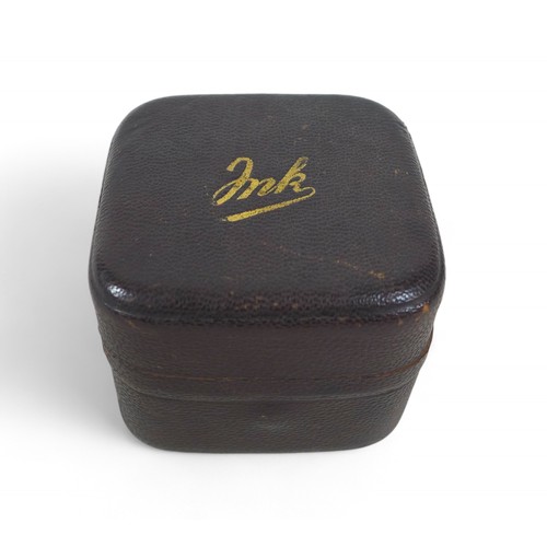 164 - A vintage travel leather covered ink well, with glass bottle and brass interior, 6 by 6 by 4.5cm.