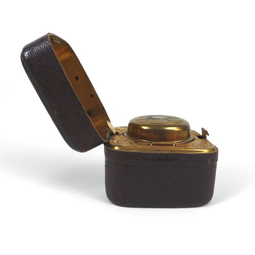 164 - A vintage travel leather covered ink well, with glass bottle and brass interior, 6 by 6 by 4.5cm.