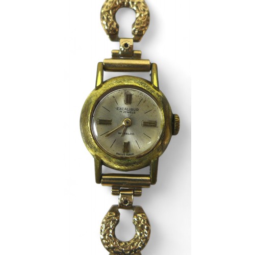 121 - A ladies Excalibur watch, with 9ct gold horseshoe design strap and yellow metal case, gross weight 1... 