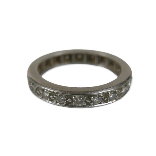 74 - An 18ct white gold and diamond eternity ring, size M. total weight 4.8g.