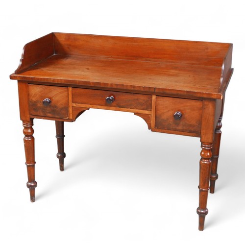 311 - A 19th century mahogany wash stand, with turned legs, 112 by 53 by 90.5cm high.