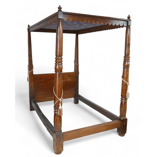 355 - A 19th century oak four poster bed, with canopy supported by turned supports, 133 by 217 by 222cm hi... 