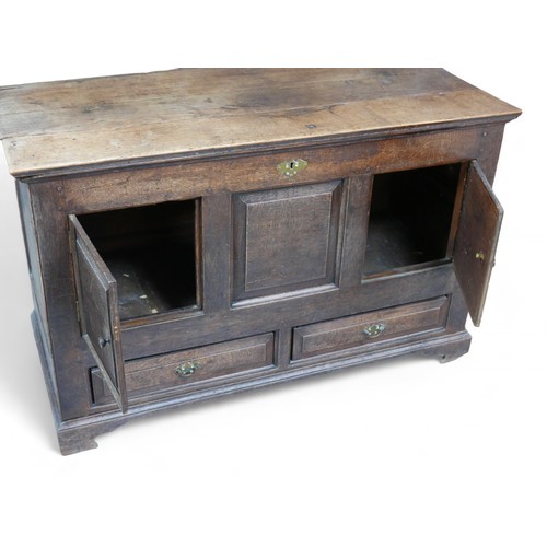 336 - An adapted 19th century oak mule chest, with panel cupboard doors, raised upon later castors, 118 by... 