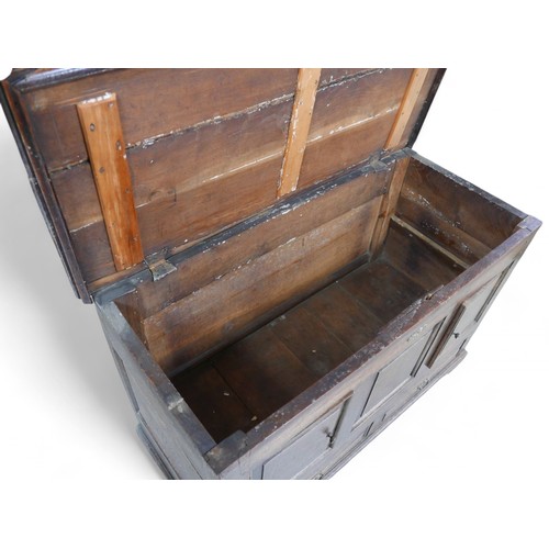 336 - An adapted 19th century oak mule chest, with panel cupboard doors, raised upon later castors, 118 by... 