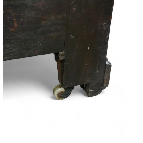 336 - An adapted 19th century oak mule chest, with panel cupboard doors, raised upon later castors, 118 by... 