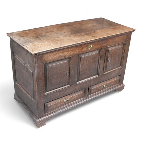 336 - An adapted 19th century oak mule chest, with panel cupboard doors, raised upon later castors, 118 by... 