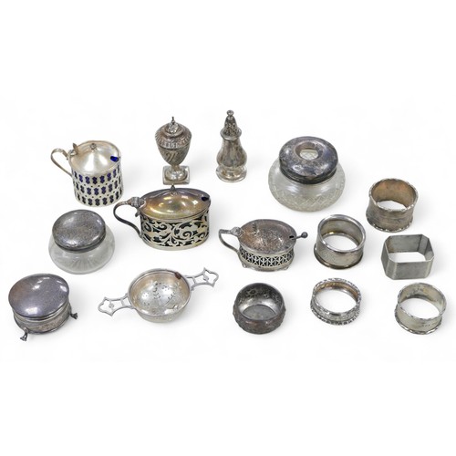 92 - A collection of Victorian and later silver cruets and napkin rings, 10.8toz of silver. (1 bag)