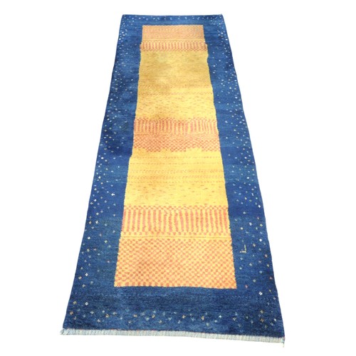 348 - A Gabbeh runner rug, blue border and a yellow and orange central rectangle, 255 by 83cm.