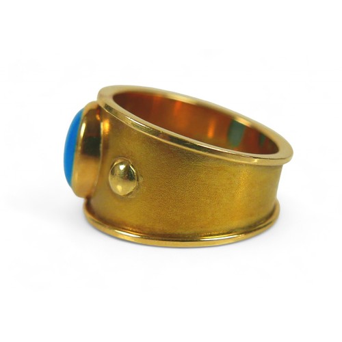 63 - An 18ct gold and turquoise ring, the single oval cut turquoise stone, 9 by 7mm, size Q/R, 11.1g.