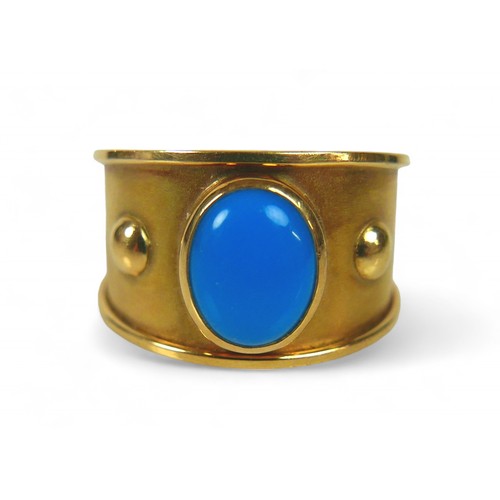 63 - An 18ct gold and turquoise ring, the single oval cut turquoise stone, 9 by 7mm, size Q/R, 11.1g.