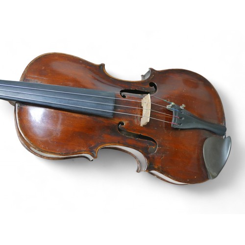 196 - Two 19th century continental violins, comprising one bearing a label 'Petrus Gyarnerius Filius Josep... 