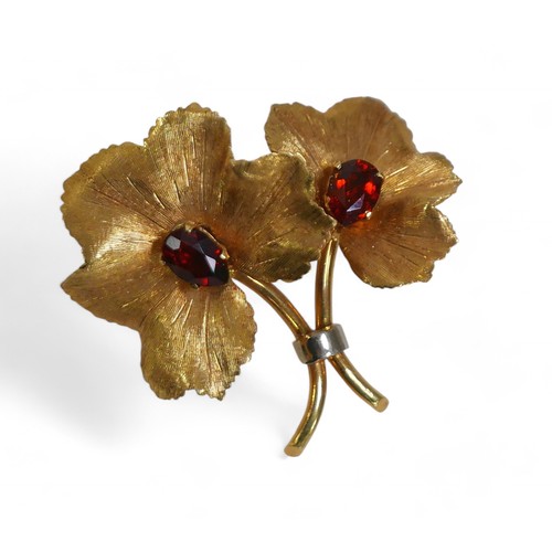 81 - An 18ct gold and garnet style stone floral brooch, each pear cut stone approximately, 6.5 by 4.5mm, ... 