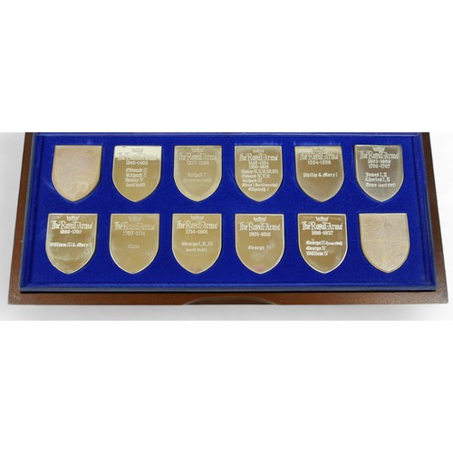 128 - A set of twelve silver proof shield shaped ingots, 