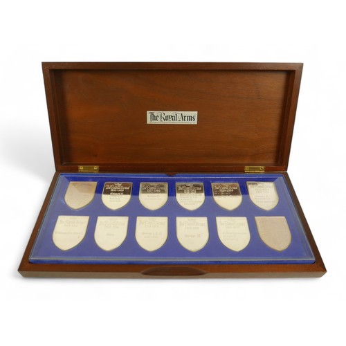 128 - A set of twelve silver proof shield shaped ingots, 