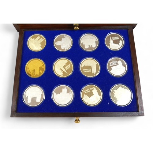 2 - A cased set of thirty six proof Silver medallions - the beauty of Britain's churches , with folder, ... 