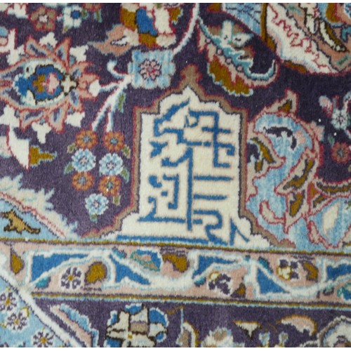 385 - A Persian hand knotted woolen carpet, with a blue field and stylized border, 405 by 308cm.