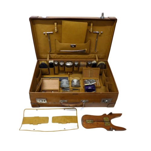 286 - A George V fitted tan leather suitcase by Drew and Sons London, fittings include five silver top bot... 