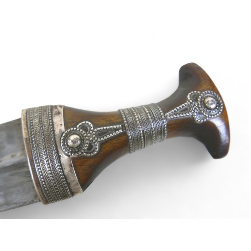 290 - An Omani silver  Khanjar dagger  with rhino horn handle late 19th early 20th century, with J shape s... 