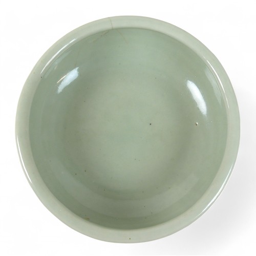 174 - A Chinese celadon footed bowl, character mark to base, 25 cm diameter by 9cm high.