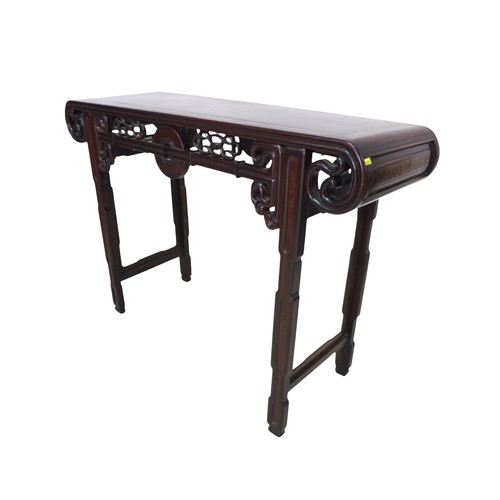 384 - A Chinese hardwood altar table, with a carved frieze, 118 by 39 by 84cm high.