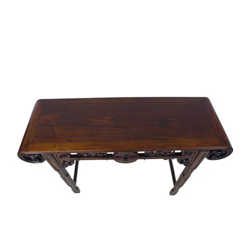 384 - A Chinese hardwood altar table, with a carved frieze, 118 by 39 by 84cm high.