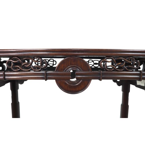 384 - A Chinese hardwood altar table, with a carved frieze, 118 by 39 by 84cm high.