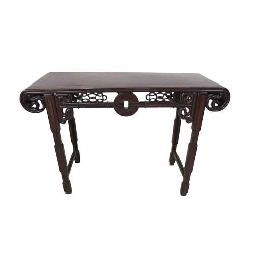 384 - A Chinese hardwood altar table, with a carved frieze, 118 by 39 by 84cm high.